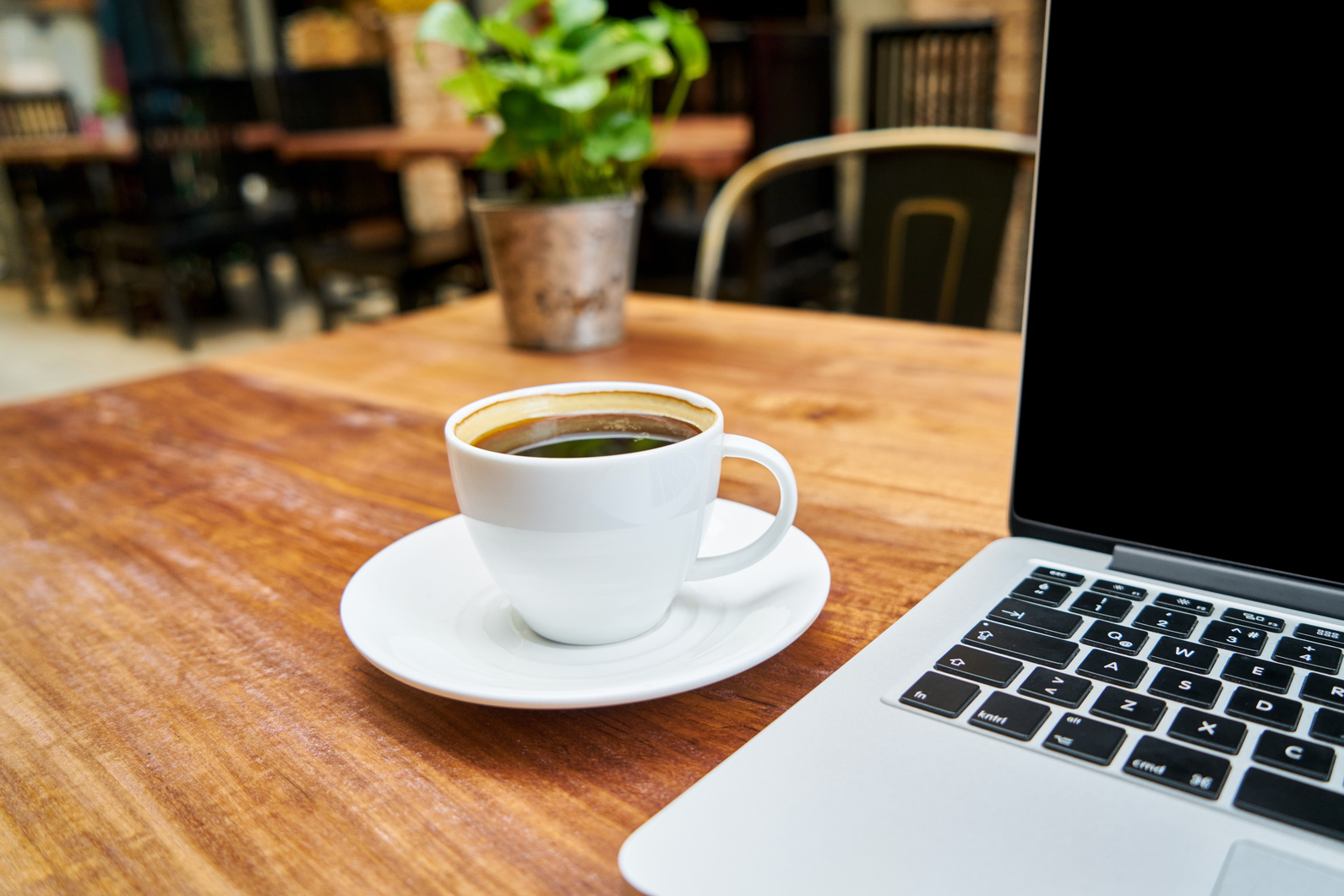 Coffee and a Laptop on a Wooden Table